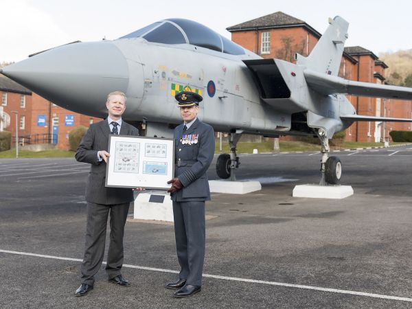 Ben Glazier presenting the official RAF100 stamps to Gp Cap James Brayshaw 