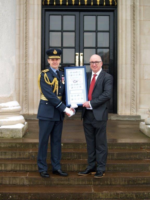 Tony Randle, representative from the Isle of Man Post Office, presenting the 100 Years of the RAF Commemorative Plaque to the Royal Air Force College Cranwell 