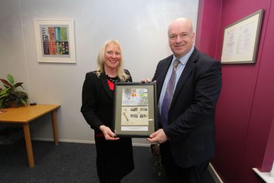 Chief Minister Howard Quayle MHK presented with framed set of stamps by Isle of Man Post Office Chairman Julie Edge MHK at recent visit