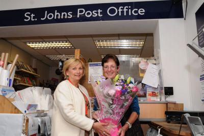 Rob Knighton takes over the reins at St John's Post Office as Rita Robinson retires