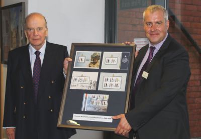 Ray Harmer MHK presents The Master Gunner General Sir Timothy Granville-Chapman GBE KCB with a framed set of stamps