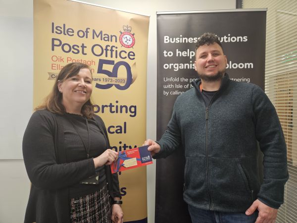 Valerie Robb, Managing Director of HPB Assurance presented with her prize by IOMPO Commercial Account Manager Aaron Craine